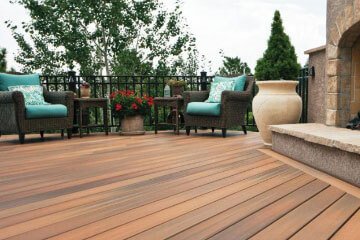 Elegant outdoor patio in Malden, CA with cushioned chairs and decorative plants.